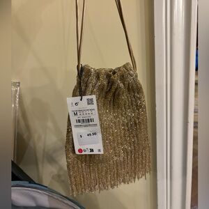 Zara gold beaded night bag with fridges.